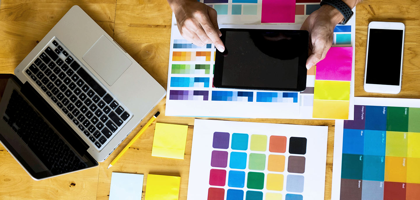 What is graphic design - a designer looking at colour swatches