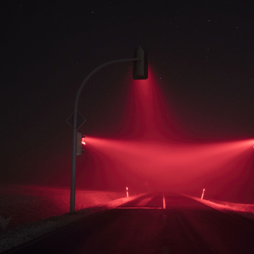 Everyday Magic - Lucas Zimmermann street lighting image, all red and moody
