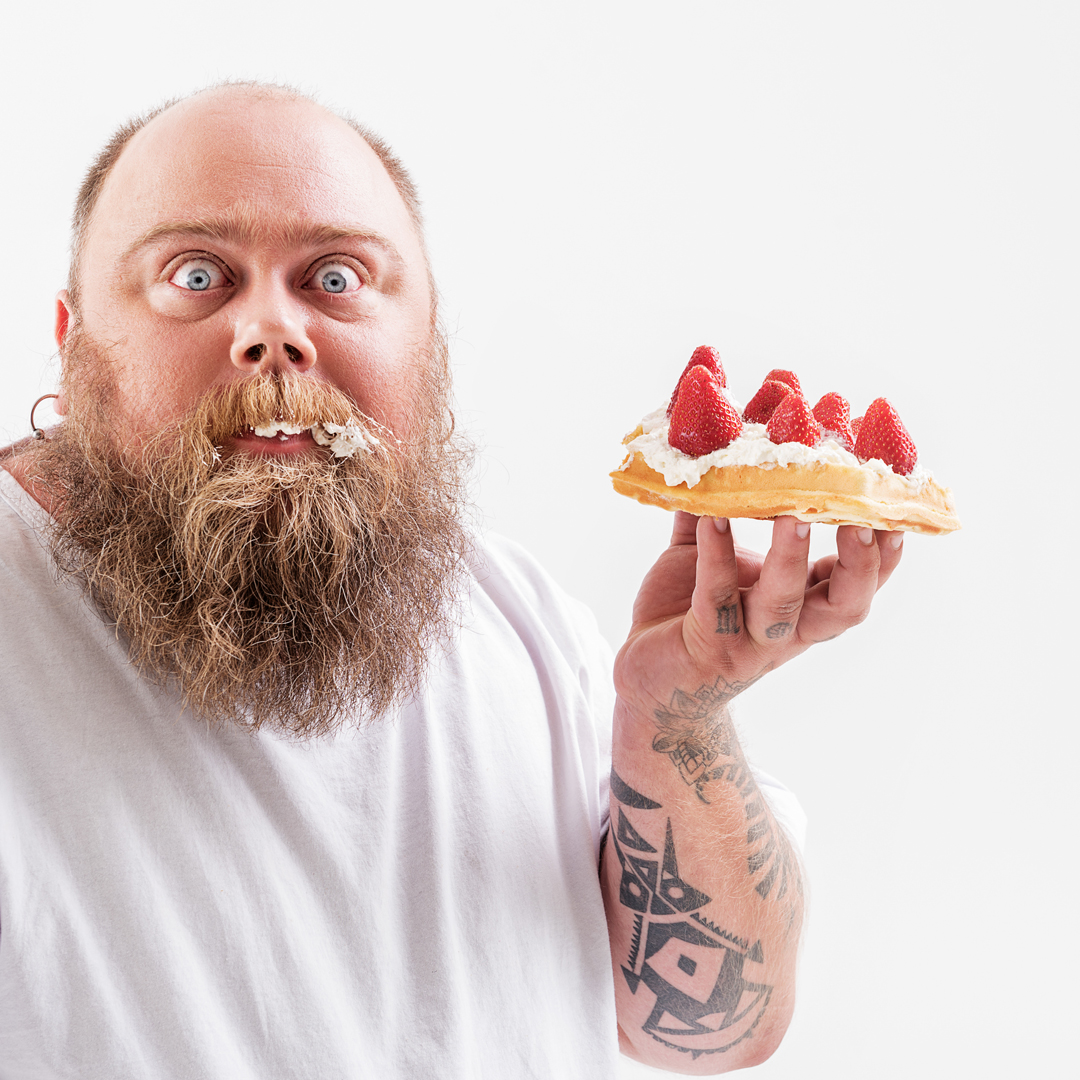 man eating cake - Are you paying too much for your graphic design